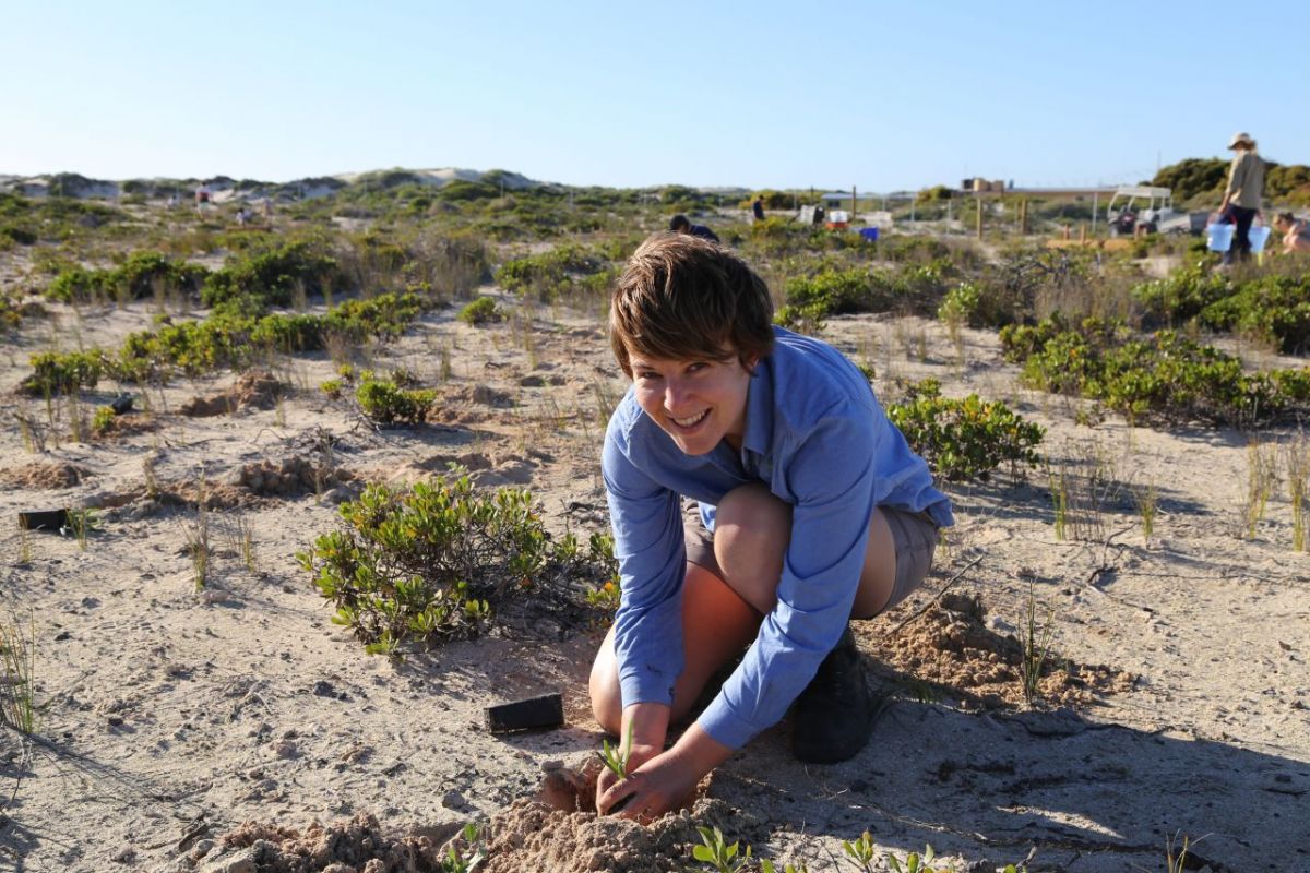 NACC NRM Officer Heather Legge planting some seedlings